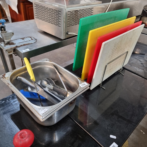 779 - A selection of commercial kitchen items including a stainless steel trough, knives, tongs and commer... 