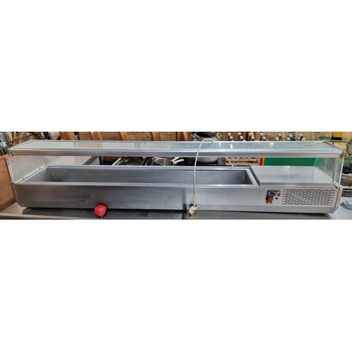 781 - Star lot : A large commercial stainless steel saladette/refrigerated food display with glass surface... 