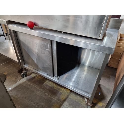 782 - Star lot : A stainless steel commercial kitchen work station unit with Gallery back and cupboard wit... 