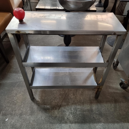 786 - A stainless steel commercial kitchen work station unit with two shelves. From a recently closed mode... 