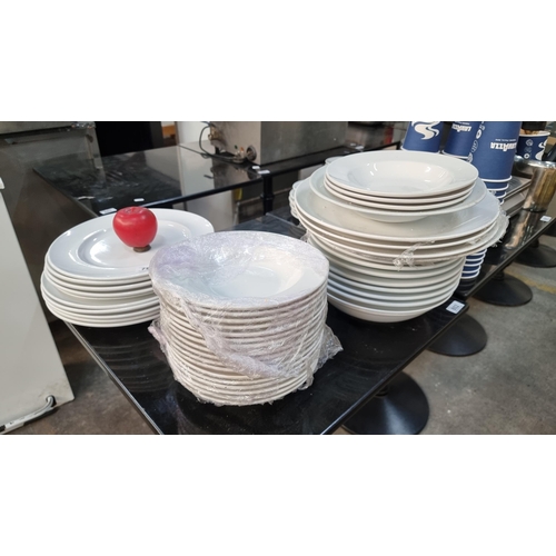 792 - A large collection of approx. 44 white dinner plates, bowls and serving plates. In very good conditi... 