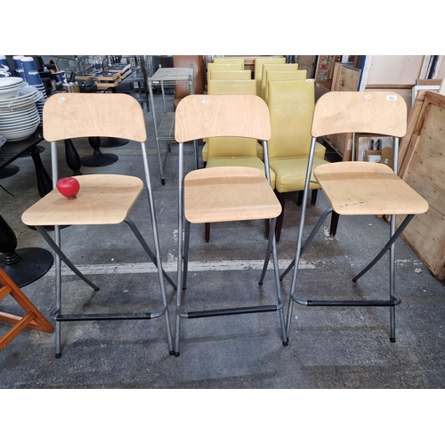 793 - A trio of wooden foldable high stools. From a recently closed modern cafe.