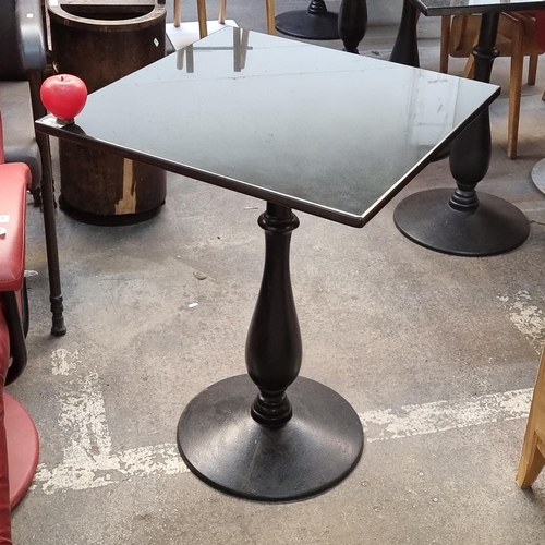 799 - Star Lot : A high quality granite top rectangular cafe/bistro table with a circular cast iron base. ... 