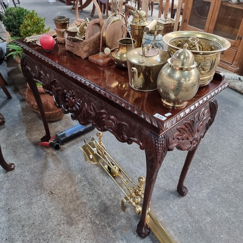 838 - A handsome dark mahogany console table with carved apron in lovey condition.