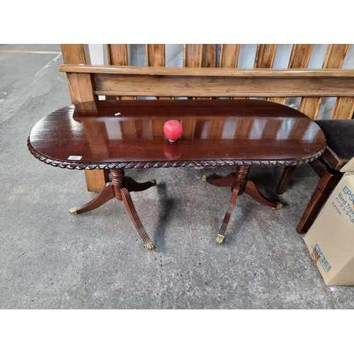 841 - A lovely dark mahogany double pedestal coffee table with rope edge and brass feet. Its in super cond... 