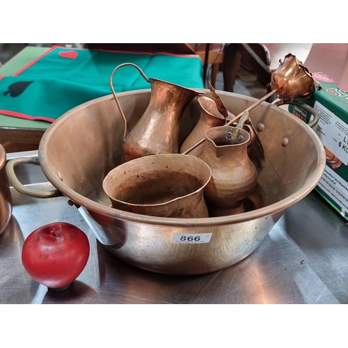 866 - A selection of six copper items including hand hammered pitchers, a rose and a large basin.