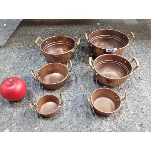 872 - A collection of 6 lovely copper and brass pots in graduating sizes.