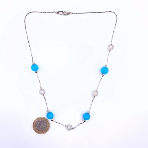 670 - A pollisged agate stone necklace with silver chain, length 46cm.