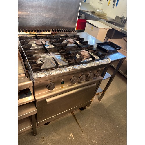 821 - Star Lot : An Electrolux Gas 4 ring Cooker and oven. In Good working order. The buyer would need to ... 