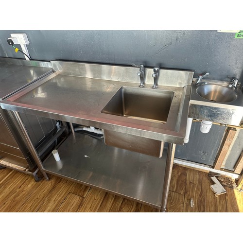 828 - Star Lot : A good Stainless Steel Sink with gallery back and shelf to bottom. 150ocm long. The buyer... 