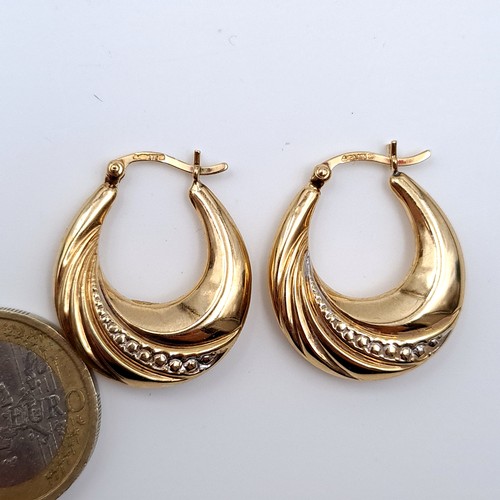 614 - A pair of 9K gold (375) hoop earrings suitable for pierced ears, total weight 2.52 grams.Boxed