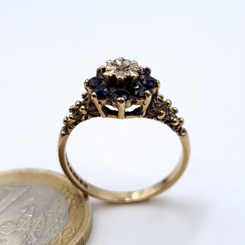 616 - Star Lot : A sapphire and illusion set diamond ring with floral mounted shoulders ring size O, weigh... 