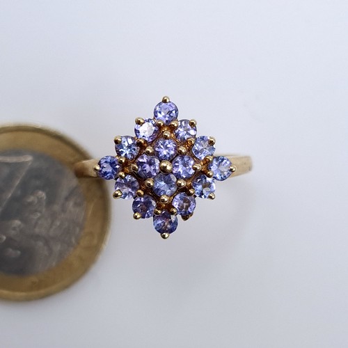 617 - Star Lot : An attractive tazanite stone cluster ring mounted in 9K gold (375), size P, weight 2.33 g... 