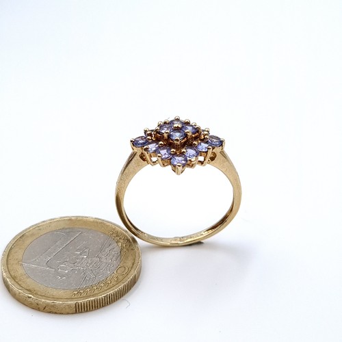 617 - Star Lot : An attractive tazanite stone cluster ring mounted in 9K gold (375), size P, weight 2.33 g... 