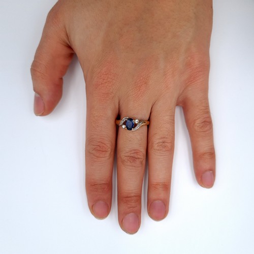 619 - Star Lot : A nice example of a blue sapphire stone ring with gemstone twist mount setting, size Q, w... 