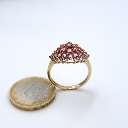 621 - Star Lot : A most attractive pink sapphire and diamond cluster ring set in 9K gold, size R, weight 3... 