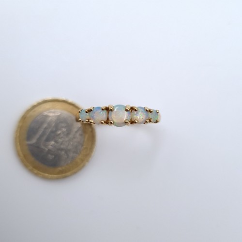 622 - Star Lot : A five stone opal ring marked 375, 9K gold, ring size R 1/2, weight 2.72 grams. Boxed.