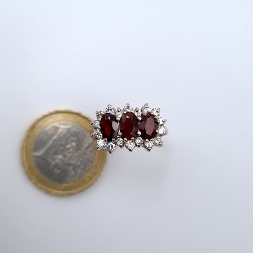 623 - Star Lot :  three stone garnet ring set in 9K gold with gem stone surround, ring size M, weight 2.46... 