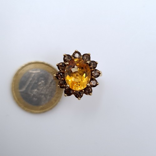 625 - Star lot : A nice example of a heavy Gold citrine stone ring with smoky quartz stone surround mounte... 