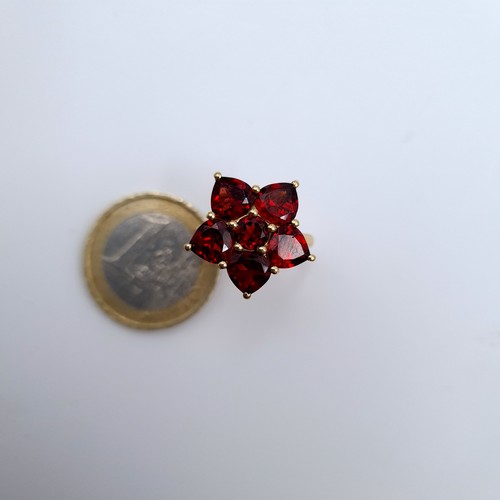 630 - Star Lot : A vintage 10K gold six stone garnet ring, ring size J 1/2, weight 3.53 grams.