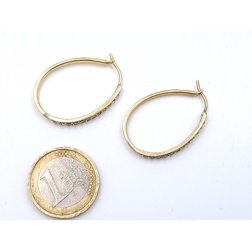 646 - A quality sterling silver  gilt diamond set hoop earrings suitable for pierced ears, total weight 4.... 