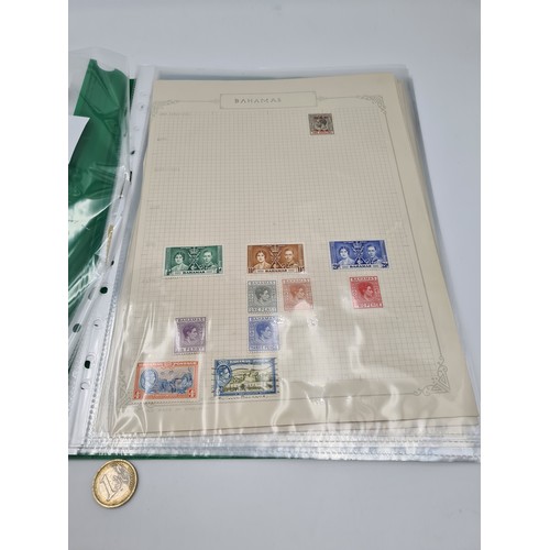 648 - A collection of British commonwealth stamp album containing a fine group of ten mint and used pages ... 