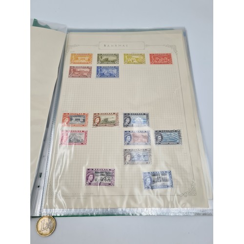 648 - A collection of British commonwealth stamp album containing a fine group of ten mint and used pages ... 