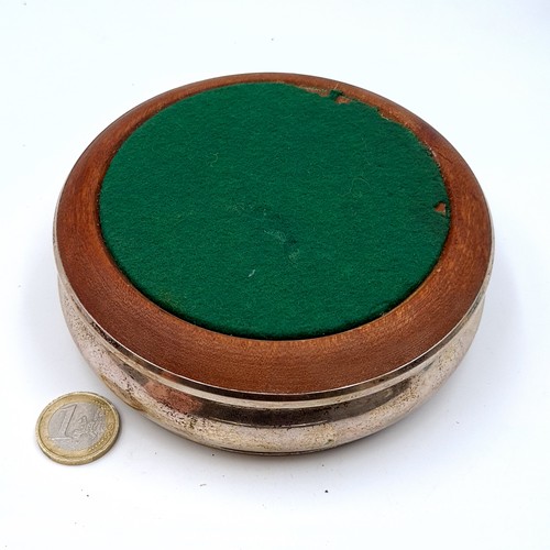 664 - A Georgian silverplated wine coaster with polished wood baise base, 13cm diameter, weight 140 grams.