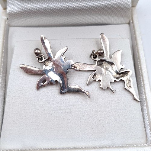 665 - A pair of sterling silver stud earrings depicting winged fairies.