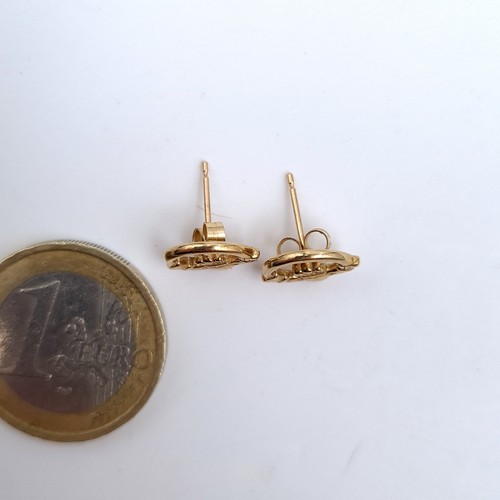 668 - A pair of 9K giold claddagh stud earrings, total weight 1.58 grams. Boxed.