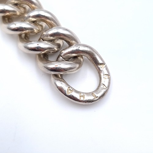 673 - A very heavy sterling silver chain link bracelet with t-bar clasp, weight 100.7 grams. Boxed.