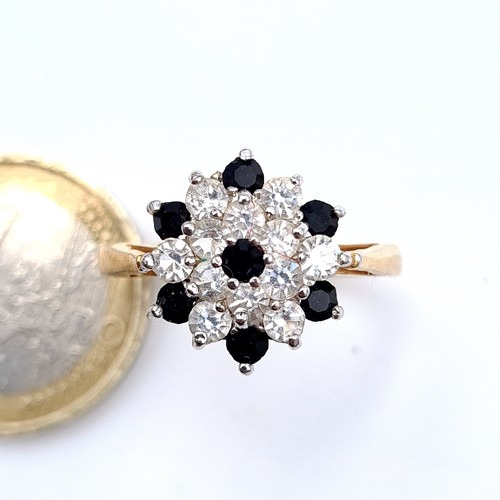 690 - A pretty gem set gold plated cluster ring, size R, weight 3.67 grams.