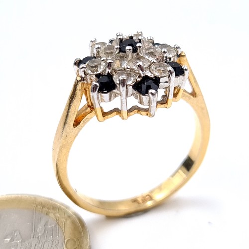 690 - A pretty gem set gold plated cluster ring, size R, weight 3.67 grams.