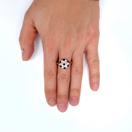 690 - A pretty gem set gold plated cluster ring, size R, weight 3.67 grams.