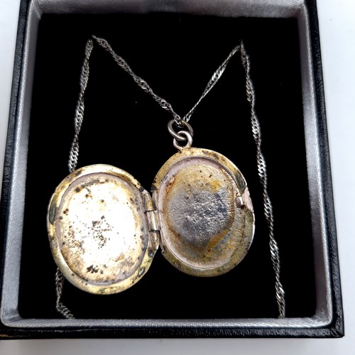 700 - A Tiffany double sided locket with Tiffany inscription to front, on reverse stamped Tiffany &co 925,... 