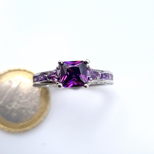 701 - An amethyst stone ring set with amethyst shoulders, mounted in sterling silver,  size V, weight 4.12... 