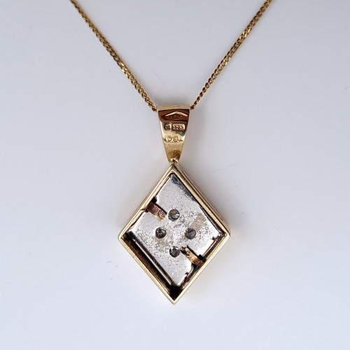 730 - Star Lot: A gorgeous diamond 9 carat gold necklace featuring a timeless lozenge pendant set with fou... 