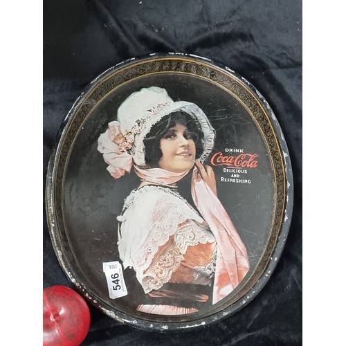 546 - A vintage Coca Cola advertising metal serving tray portraying an iconic young lady.