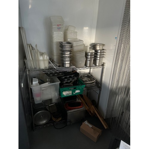 834 - A Stainless Steel rack with a selection of stainless steel and other commercial kitchen items. (does... 