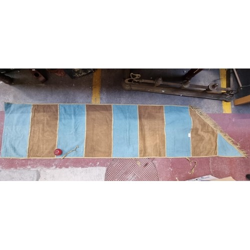 111 - A collection of 4 large and long vintage heraldic banners finished with fringe trim and featuring a ... 