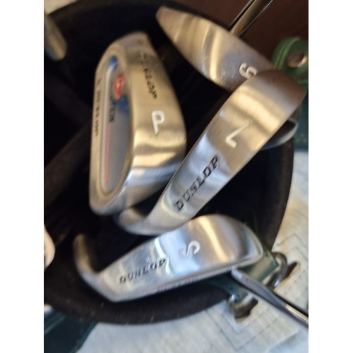 277 - A collection of 11 Dunlop Solution golf clubs including 5 and 3 woods, a driver, S and P wedges and ... 