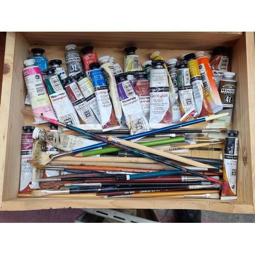 370 - Two artists boxes pack full of paint tubes and brushes. Mostly consisting of Winsor and Newton. This... 