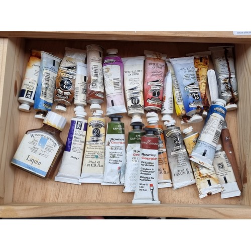 370 - Two artists boxes pack full of paint tubes and brushes. Mostly consisting of Winsor and Newton. This... 