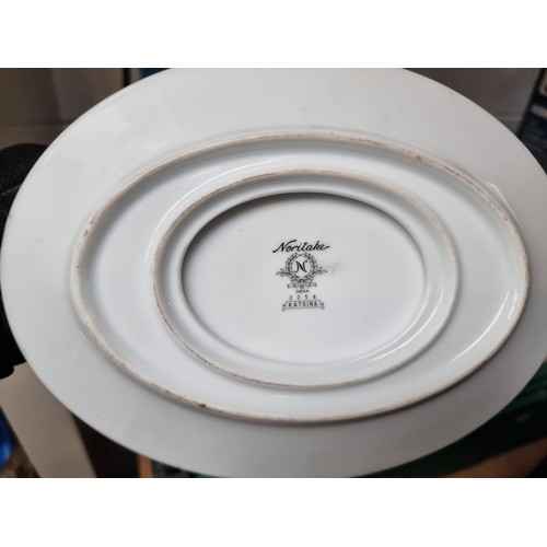 438 - A beautiful Japanese Noritake dinner serve in the Katrina pattern consisting of plates, saucers and ... 