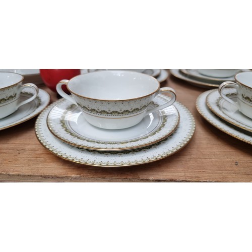 438 - A beautiful Japanese Noritake dinner serve in the Katrina pattern consisting of plates, saucers and ... 