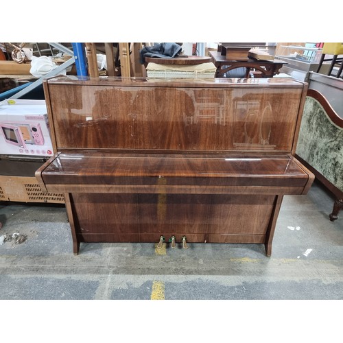 840 - Star lot : A fabulous Petrof Steel framed overstrung Piano. In fantastic condition with a matching p... 