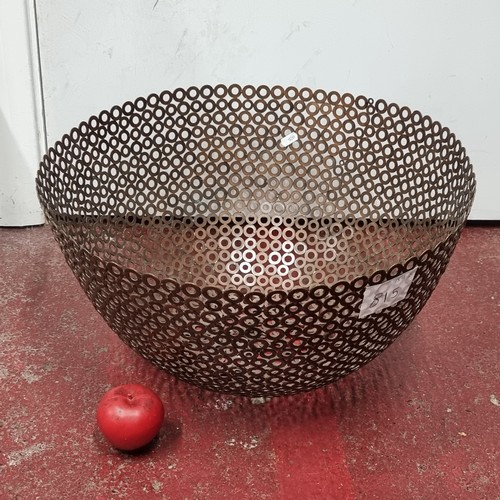 815 - A very large industrial style centrepiece bowl crafted from soldered circular metal elements. A grea... 