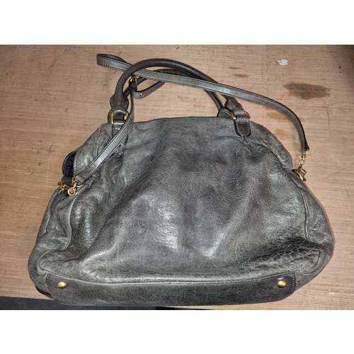 127 - Star Lot : A stylish Miu Miu Made in Italy handbag crafted from soft leather in a grey finish. With ... 