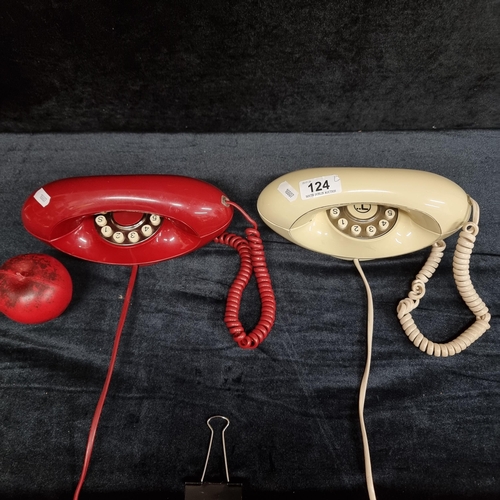 124 - A pair of sleek Mid Century UK made telephones in shades of cream and red.