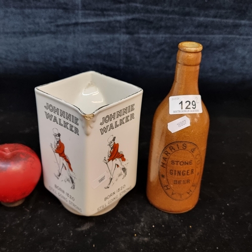 129 - Two vintage items including a Johnnie Walker whiskey jug from James Green & Nephew Ltd. Along with a... 